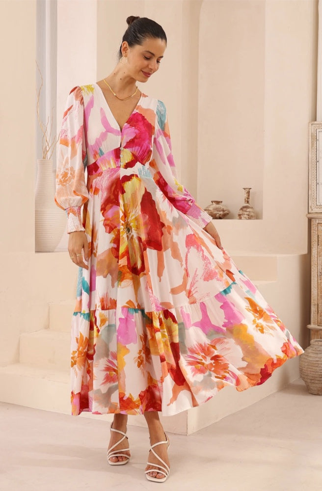 Fresco Bloom Maxi Dress, Woman wearing a colourful floral dress in an indoor setting