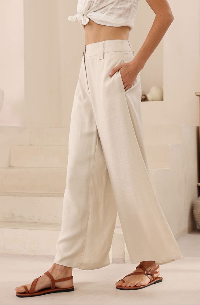 Person wearing beige wide-leg pants tailored fit not too long