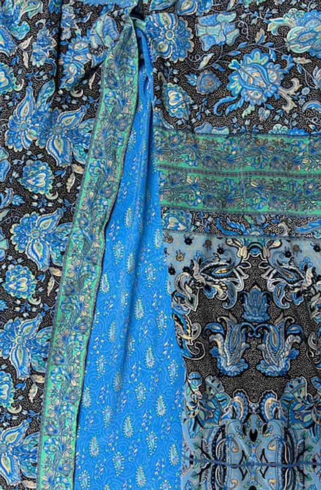 Sari Wrap Skirt Blue, Close-up of blue and black patterned fabric with waist tie. 