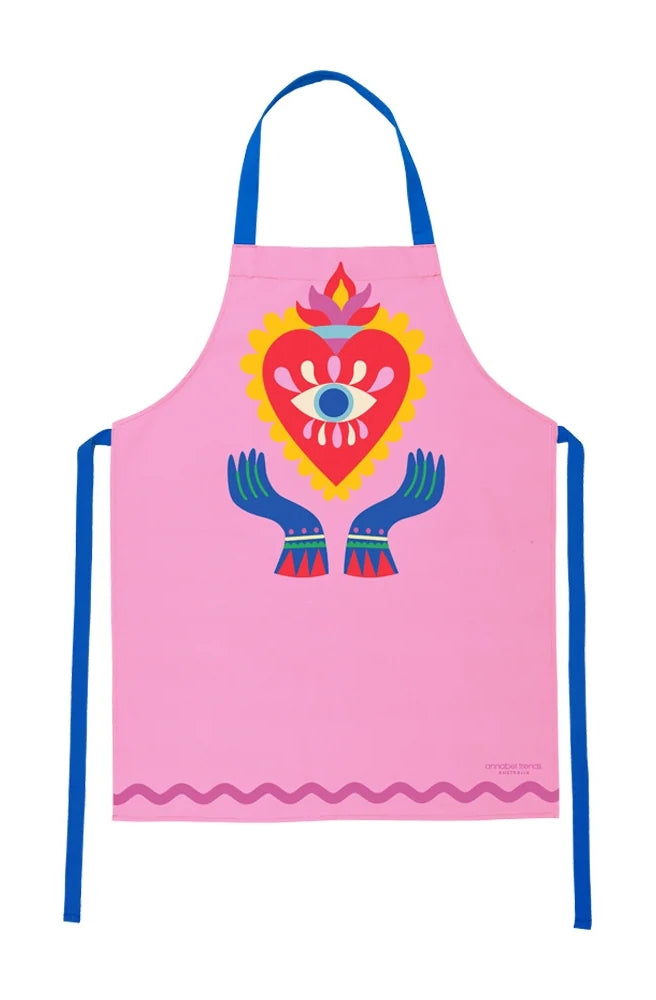 Apron Reg Printed – Fiesta Heart featuring a bright pink background and colourful heart and eye illustration.