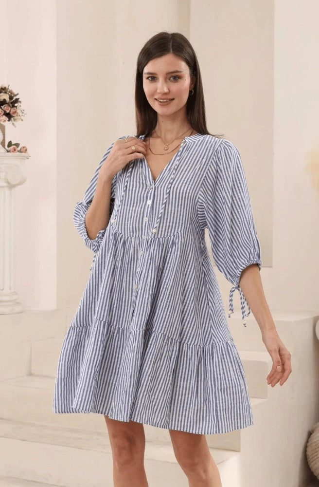 Blue and white striped cotton babydoll dress with button front and tiered skirt