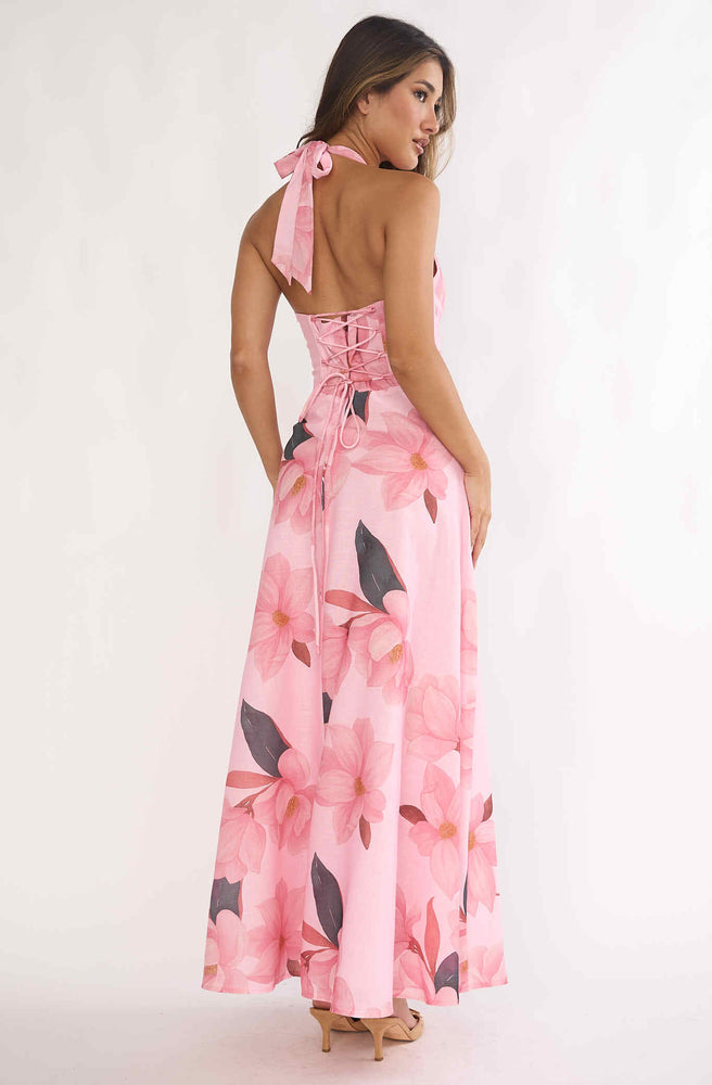 Back view of Tonketti Blush Floral halter maxi dress with lace-up corset back and soft pink floral print.