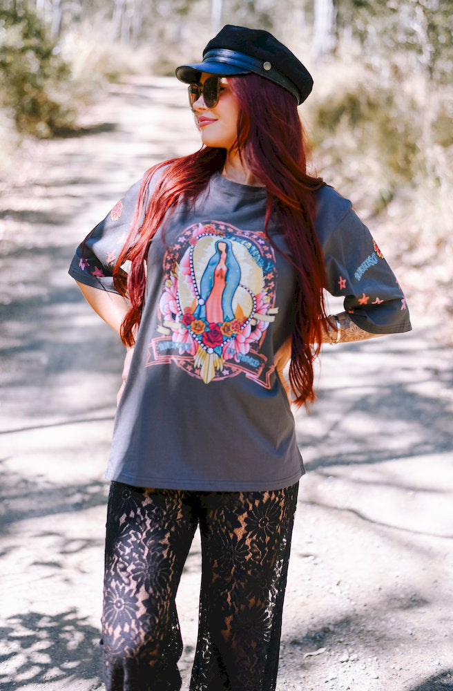 Women's charcoal graphic tee featuring a religious-inspired print with roses, stars and floral sleeve details.