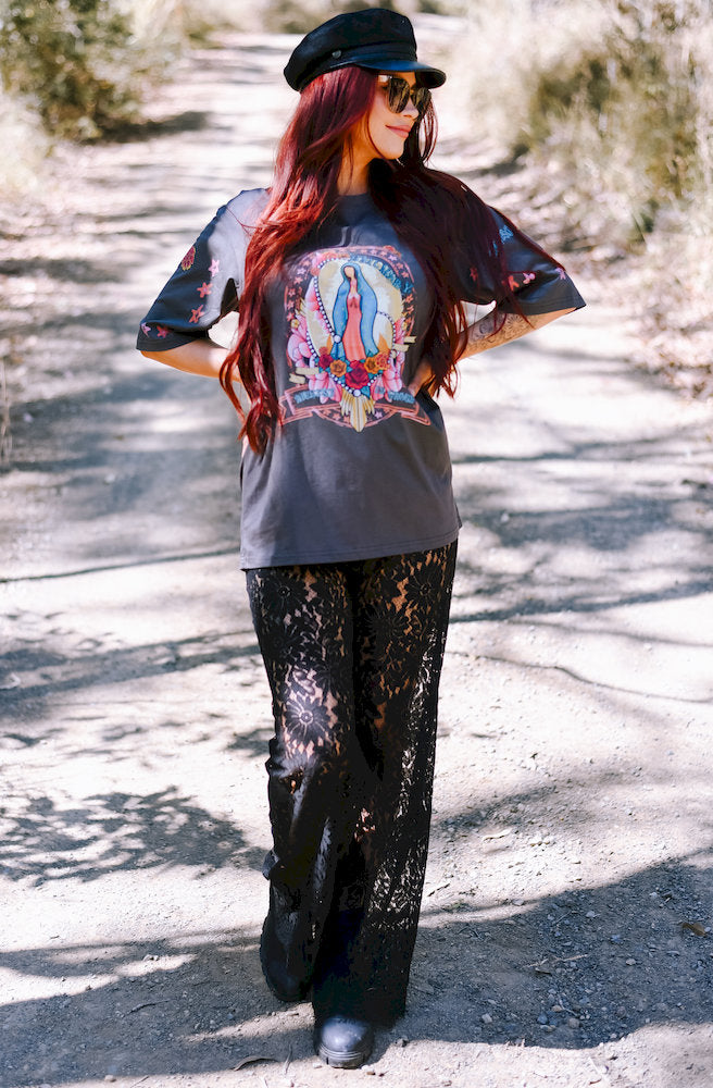 Midnight Lace Asym Lace Pants styled with a charcoal graphic tee and chunky black boots for an edgy boho look.