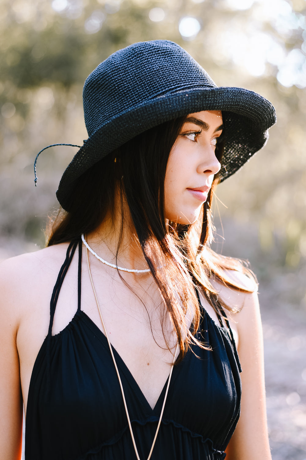 Back view of the Classic Black Bucket Hat with a decorative matching tie.