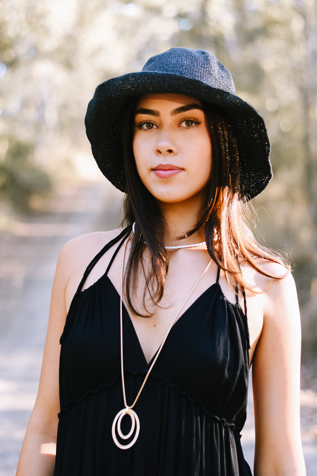 Classic Black Bucket Hat featuring a textured woven finish and curved brim.