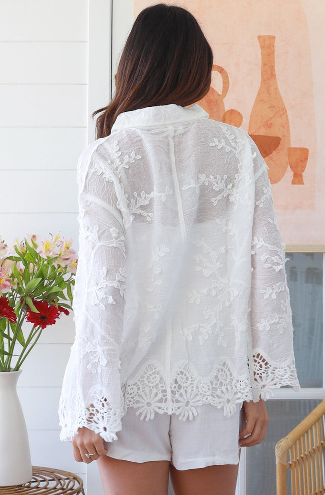 Coastal Whisper Lace Blouse styled with white linen shorts in relaxed setting