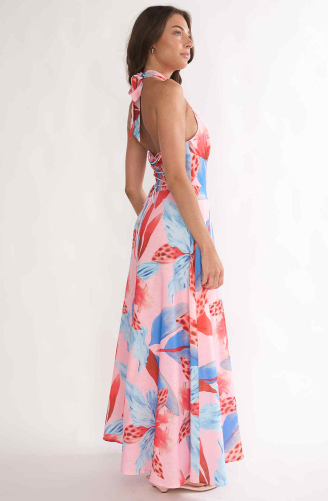 Back view of Tonketti Coral Tropics halter maxi dress with lace-up corset back and coral blue tropical floral print.