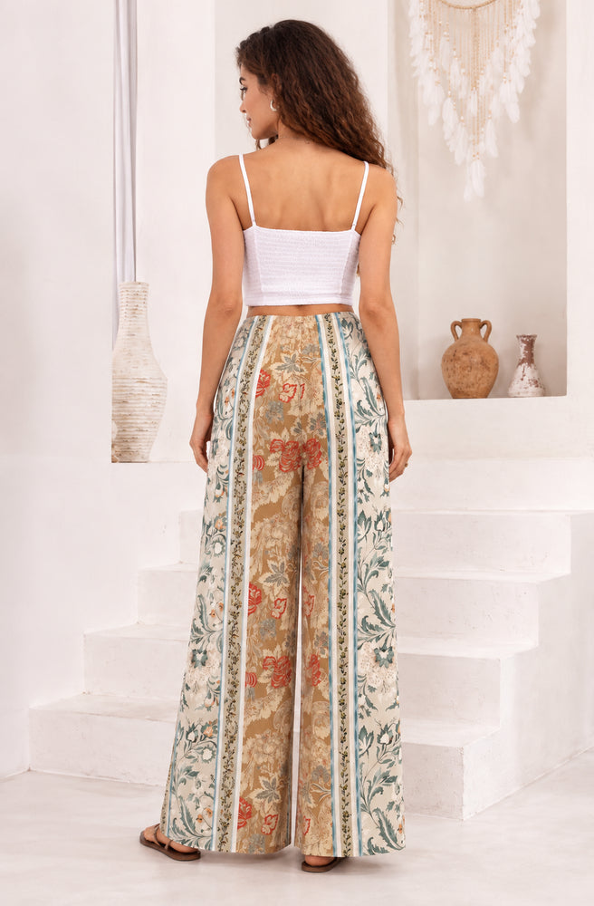 Back view of the Desert Heirloom Maxi Pants showing the elastic waistband and statement patchwork border print.