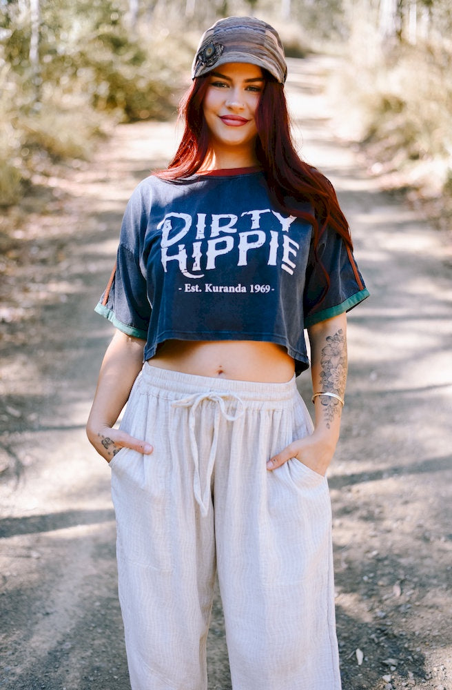 Dirty Hippy Crop Top in washed navy with bold vintage lettering, rust shoulder trim and teal sleeve cuffs.