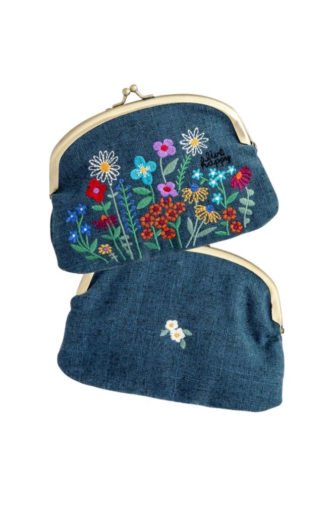 Embroidered blue floral coin purse with double kisslock closure and mustard floral interior lining