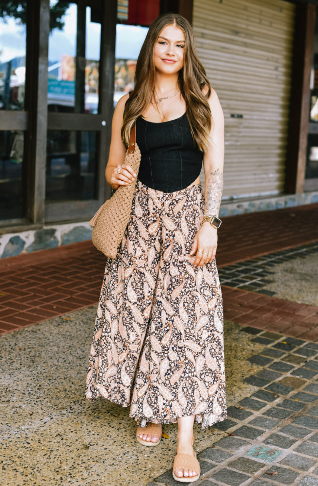 Dusk Paisley Drifter Pants featuring an earthy paisley print, relaxed flared legs and adjustable waistband