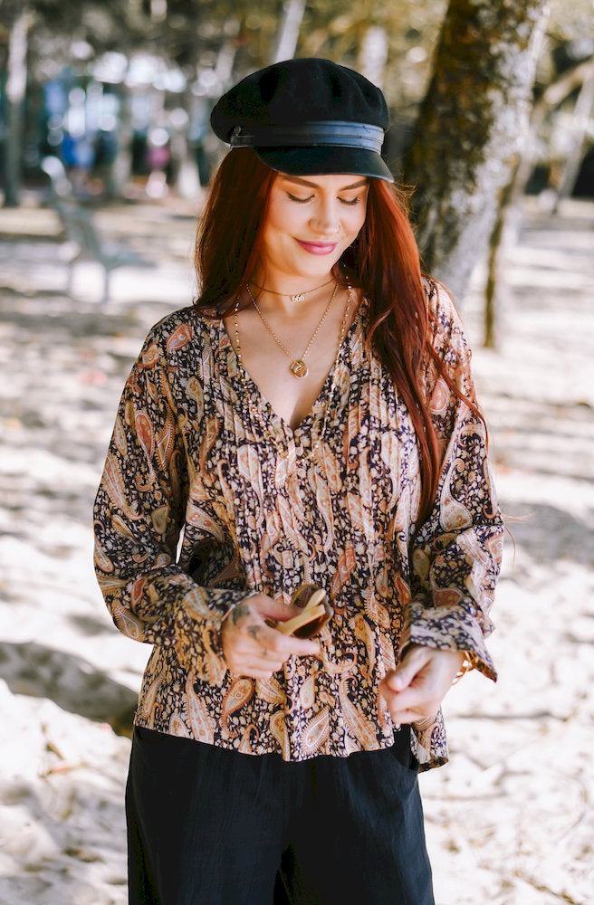 Dusk Paisley Serena Blouse featuring an earthy paisley print, V neckline, relaxed fit and full-length sleeves.