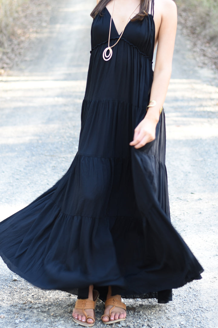 Close-up of the Ebony Umbrella Dress highlighting the lightweight rayon voile fabric and flowing gathered tiers.