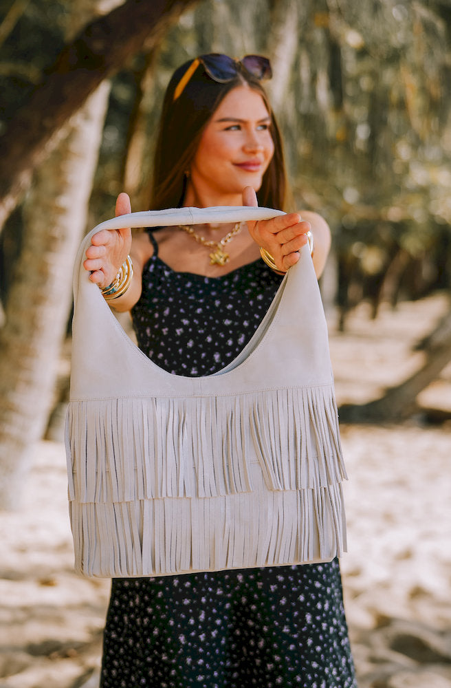 Women's Flow Leather Bag featuring a handcrafted suede shoulder bag with fringe and zip-top closure