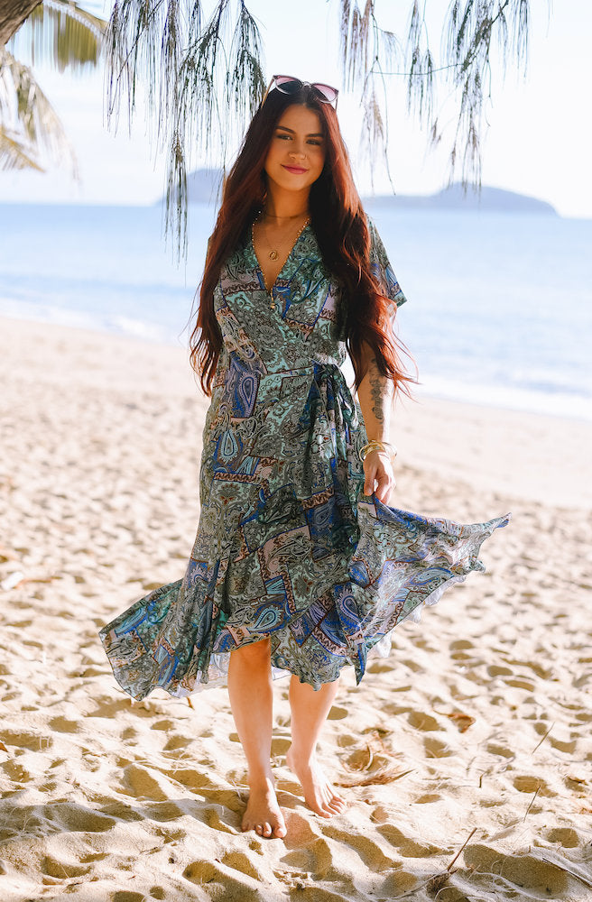 Women's Forest Patch Mirage Wrap Dress with an adjustable waist tie, V neckline and relaxed flowing midi silhouette in a colourful boho print
