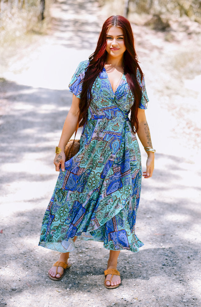 Forest Patch Mirage Wrap Dress styled as a flowing midi wrap dress with a flattering waist and lightweight skirt.