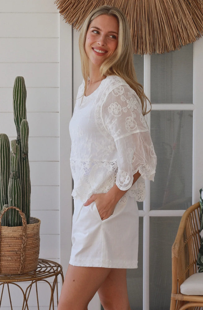 White boho lace cotton top with crochet hem and relaxed floaty sleeves