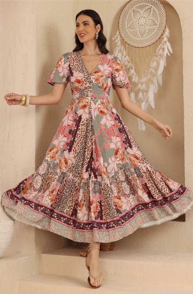 Back view of the Leopard Caravan Maxi Dress showcasing its mixed prints, relaxed sleeves and full-length flowing silhouette.