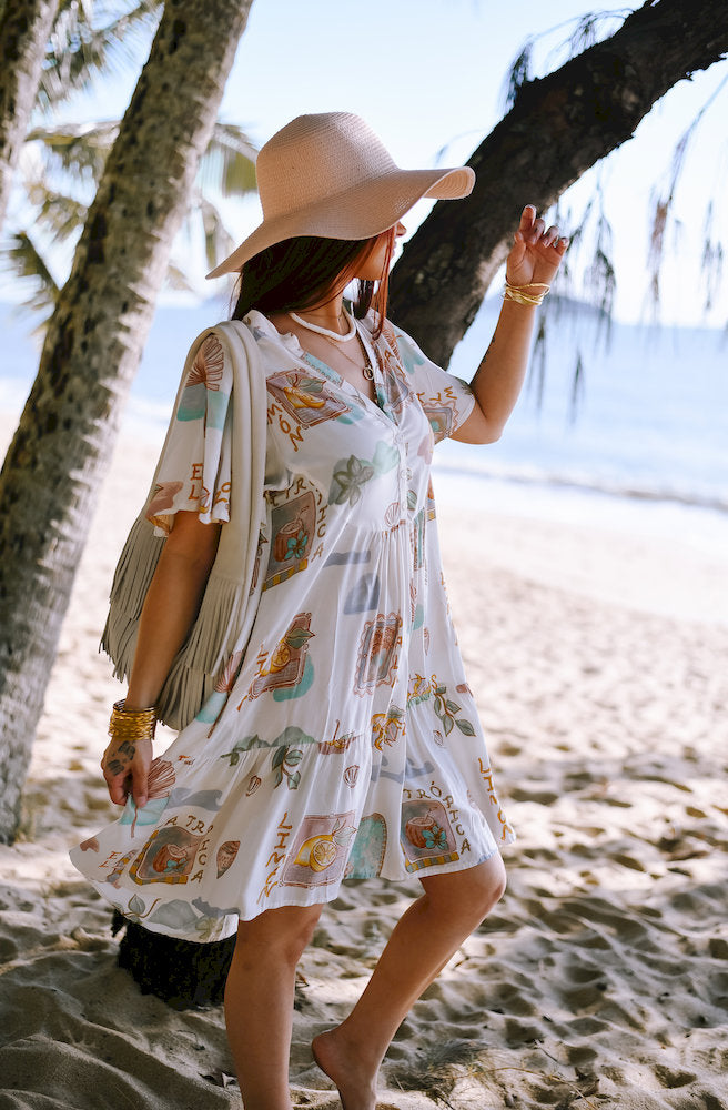 Women's Limon Cherry Mini Dress in a soft white, pastel blue and green print with a flowing tiered skirt and relaxed boho styling.