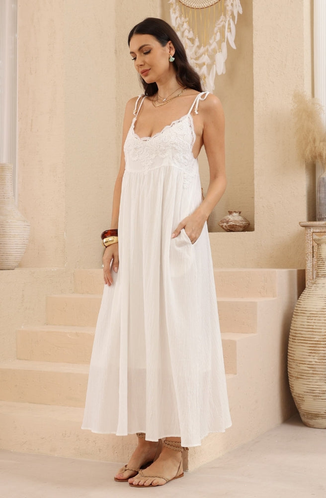 Luna Cotton Lace Dress with floral detailing, tie straps and functional pockets.