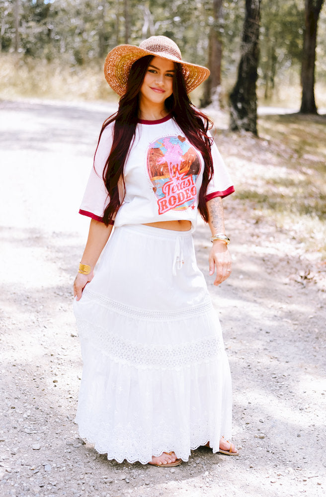Luna Cotton Lace Long Skirt in white cotton with delicate lace detailing and a flowing tiered silhouette.
