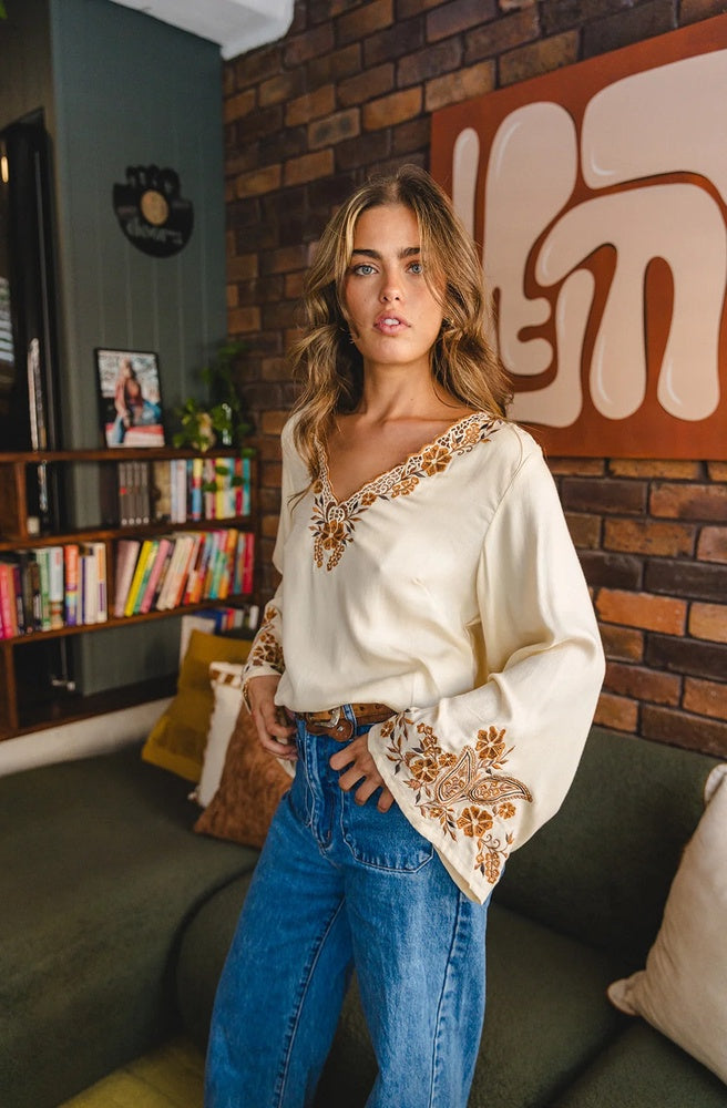 Marlo Arden Embroidered Blouse in cream with handcrafted floral and paisley embroidery, flowing bell sleeves, and relaxed fit.