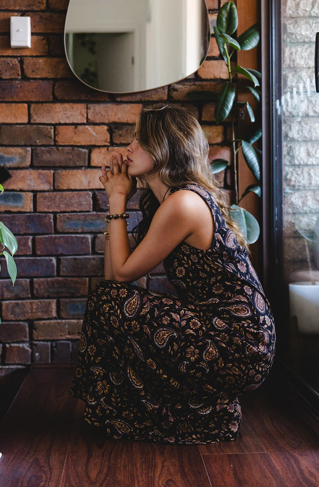 Women's flowing paisley maxi dress crafted from soft Rayon Rhito with an elegant full-length silhouette