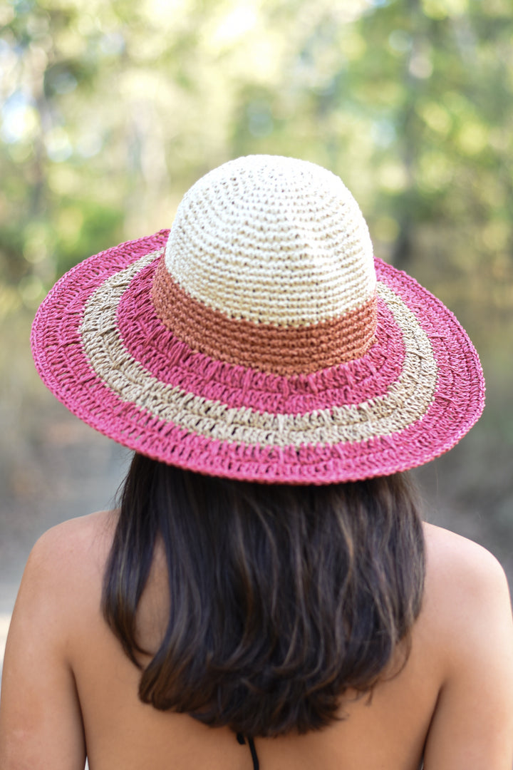 Blush pink and cream Medium Blush Brim Sun Hat with a rounded woven crown and contrasting beige band, styled with a black summer dress