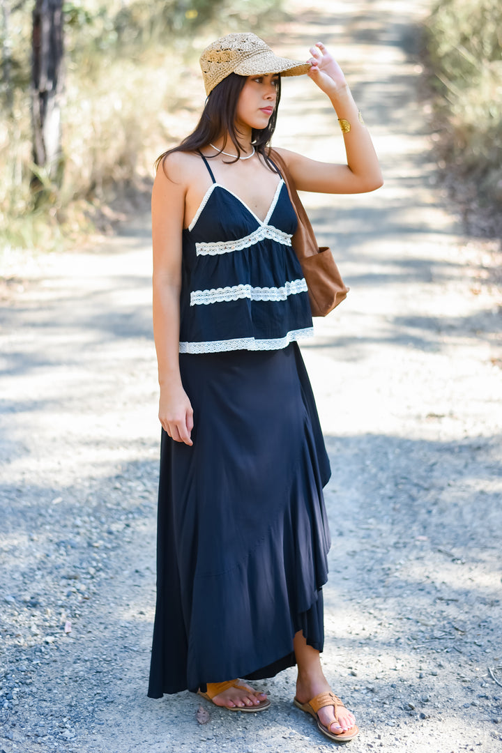 Full-length outfit featuring the Midnight Shelly Top styled with a flowing black maxi skirt and sandals. Paired with Ebony Nymph Wrap Skirt.