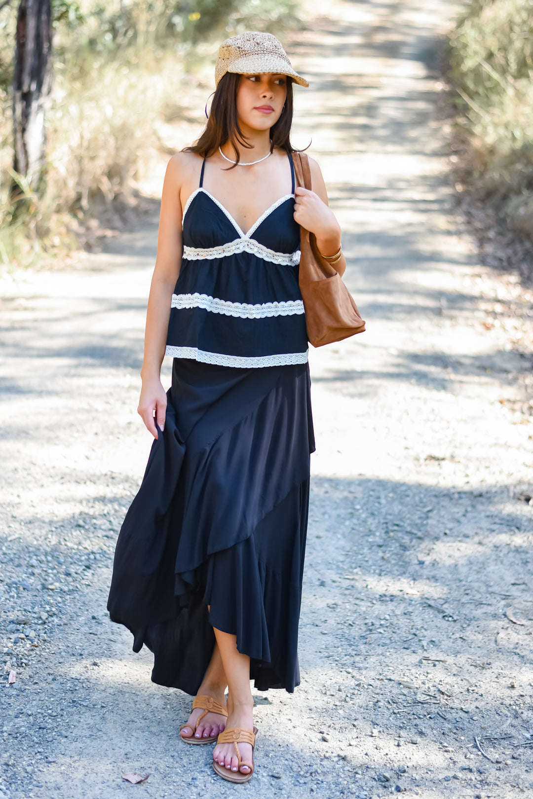 Front Viiew outfit featuring the Midnight Shelly Top styled with a flowing black maxi skirt and sandals. Paired with Ebony Nymph Wrap Skirt.