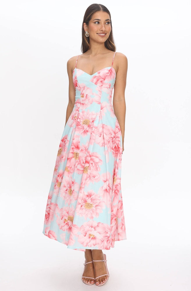 Model wearing Tonketti Mint Peony slip maxi dress with mint base and soft pink peony floral print.