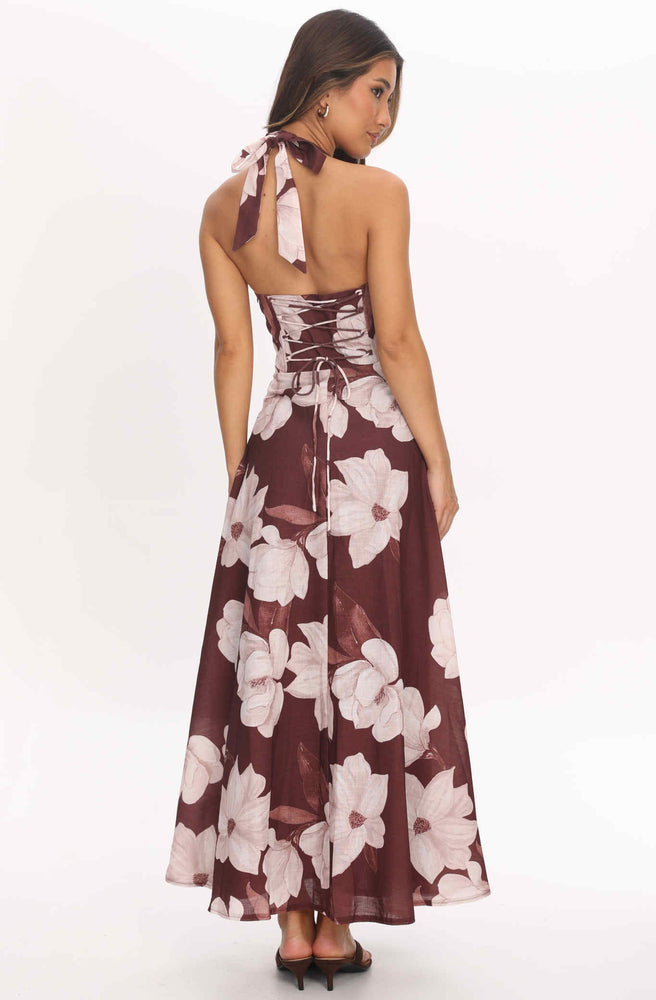 Back view of Tonketti Mocha Magnolia halter maxi dress with lace-up corset back and large magnolia floral print.