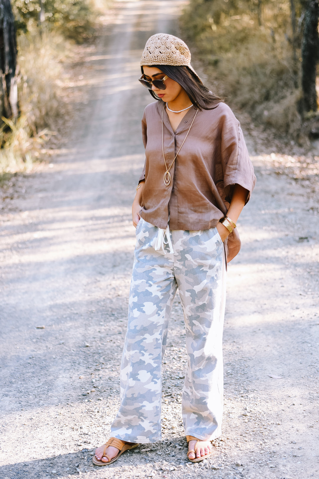 Side view of the Camo Racer Stripe Pants highlighting the contrasting taupe stripe running down the leg.
