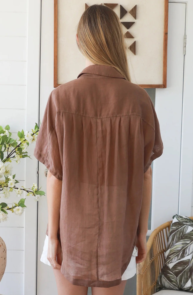 Back view of the Mocha Relaxed Button Top showing its loose fit and longer curved hem.