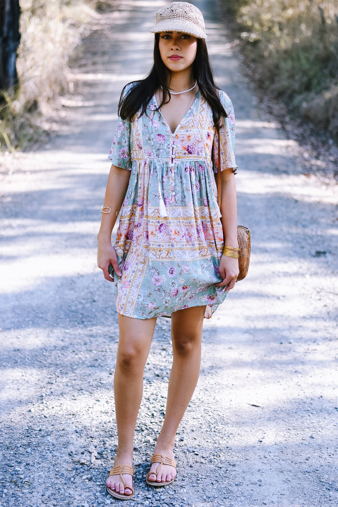 Pastel Mosaic Mini Dress in sage green with floral print, V-neckline and button front. Paired with Crochet Natural Woven Cap