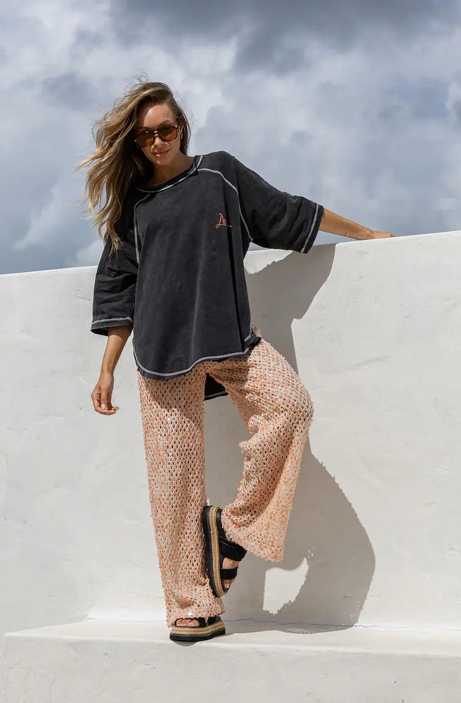 Oversized Rebel Parla cotton tee with vintage washed finish, embroidered front logo, and statement back graphic.