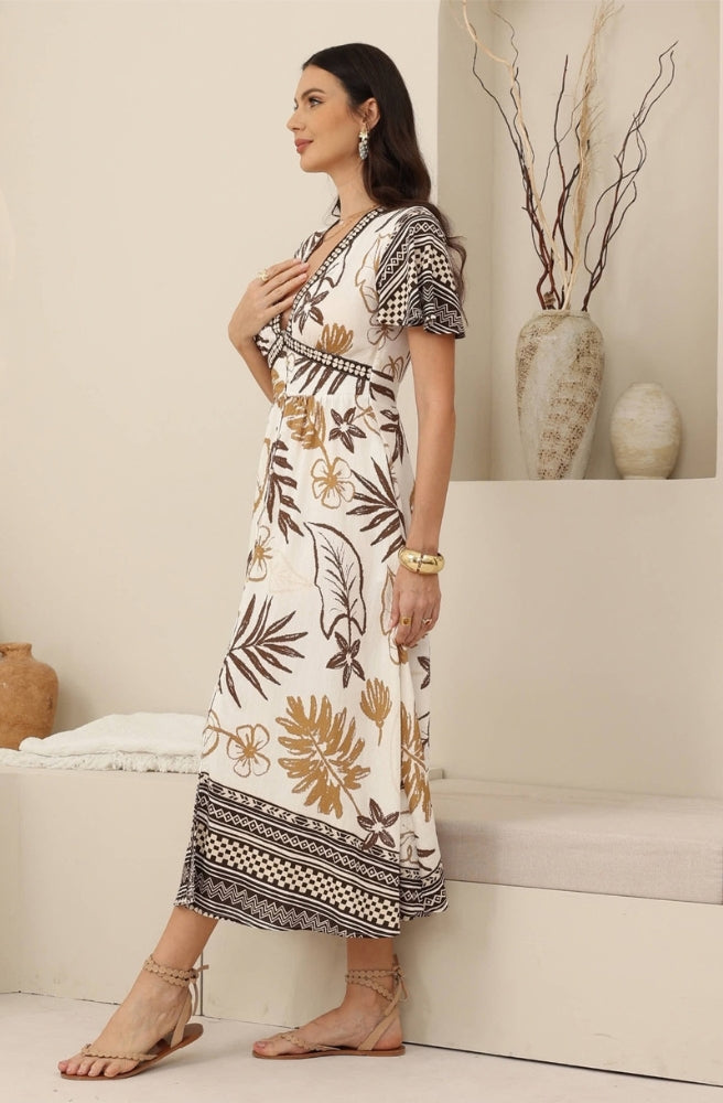 Earthy botanical print maxi dress with contrast border, gathered waist and short sleeves