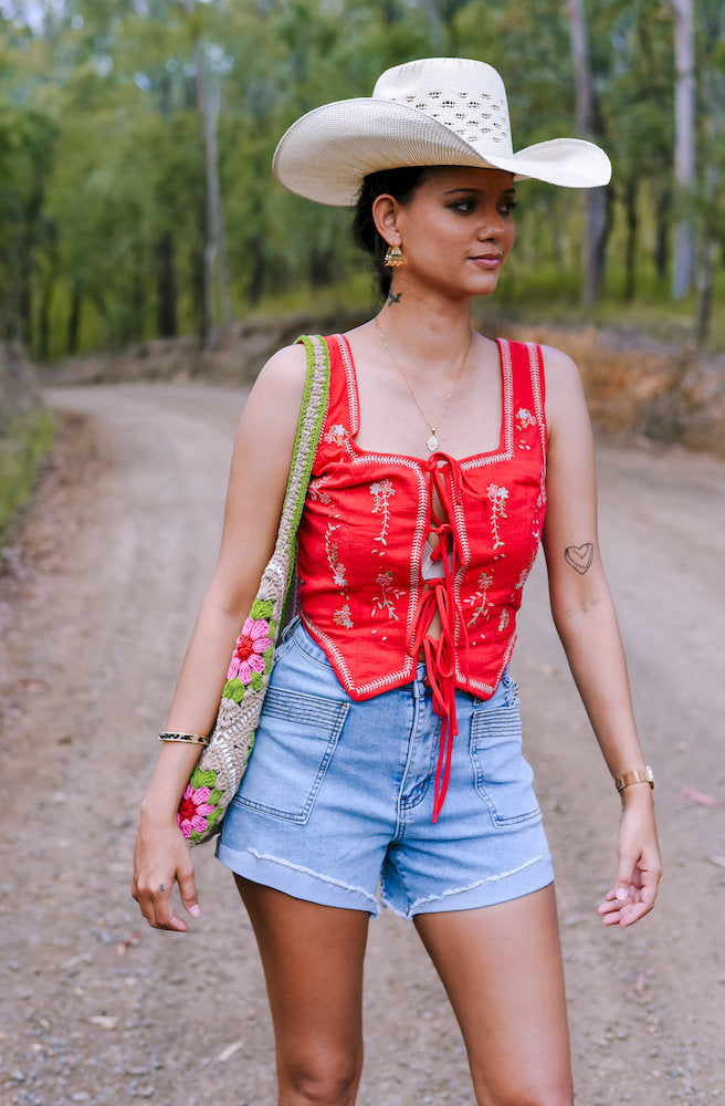 Serephina Vest Red embroidered western corset top with lace up front and denim shorts