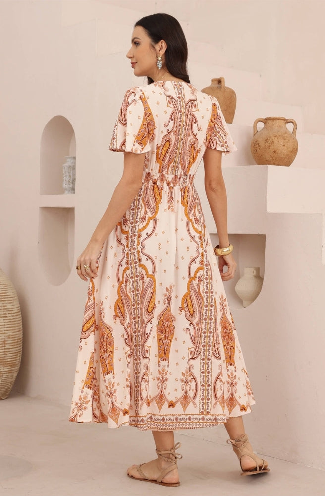 Back view of the Sienna Paisley Maxi Dress showing the intricate paisley print and flowing silhouette.