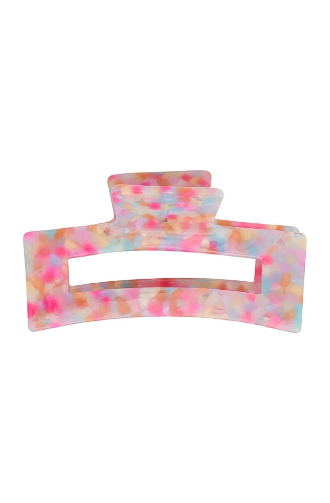 Tamed Hair Claw – Unicorn Confetti featuring a colourful pastel pattern with pink, blue and peach accents.