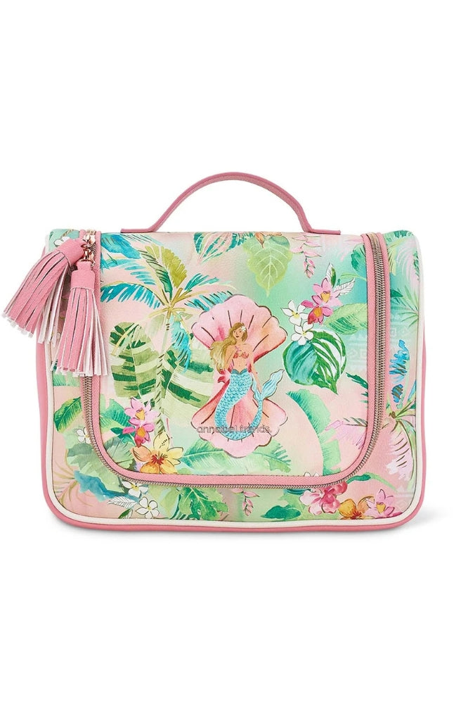Vanity Overnight Bag – Tiki Island featuring a tropical floral and mermaid print with pink tassel zip pulls.