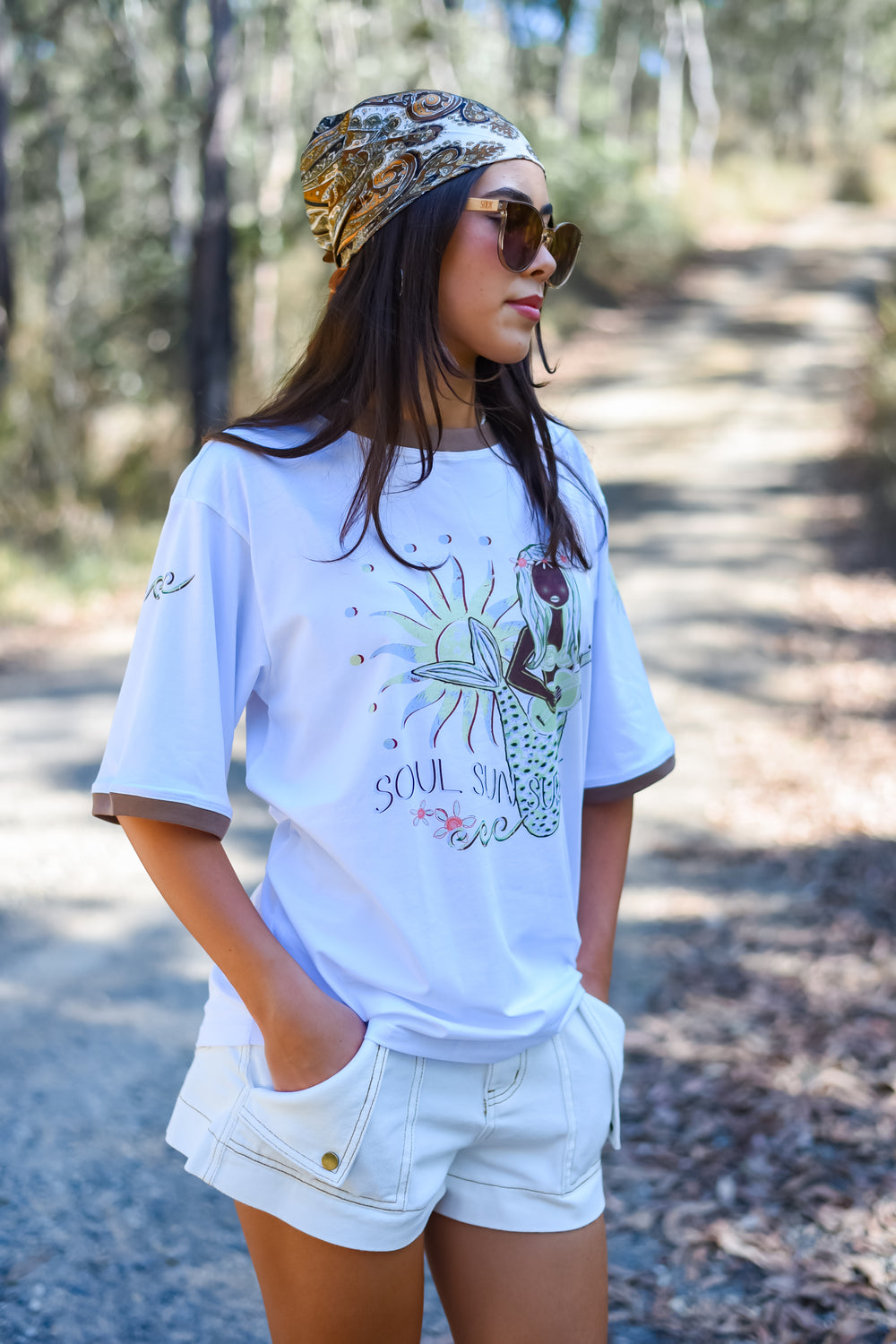 Honey wearing White Soul Surf Tee paired with Cacao Scarf and sunglasses.