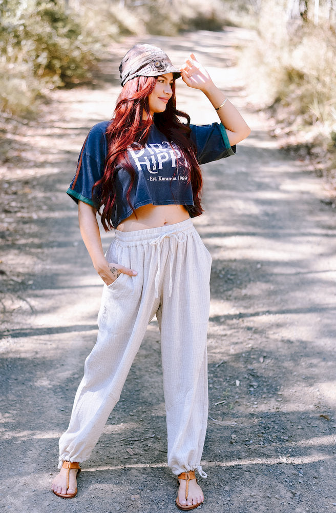 Ziggy Pants in a light natural shade featuring a relaxed fit, elasticated drawstring waist and adjustable ankle ties.